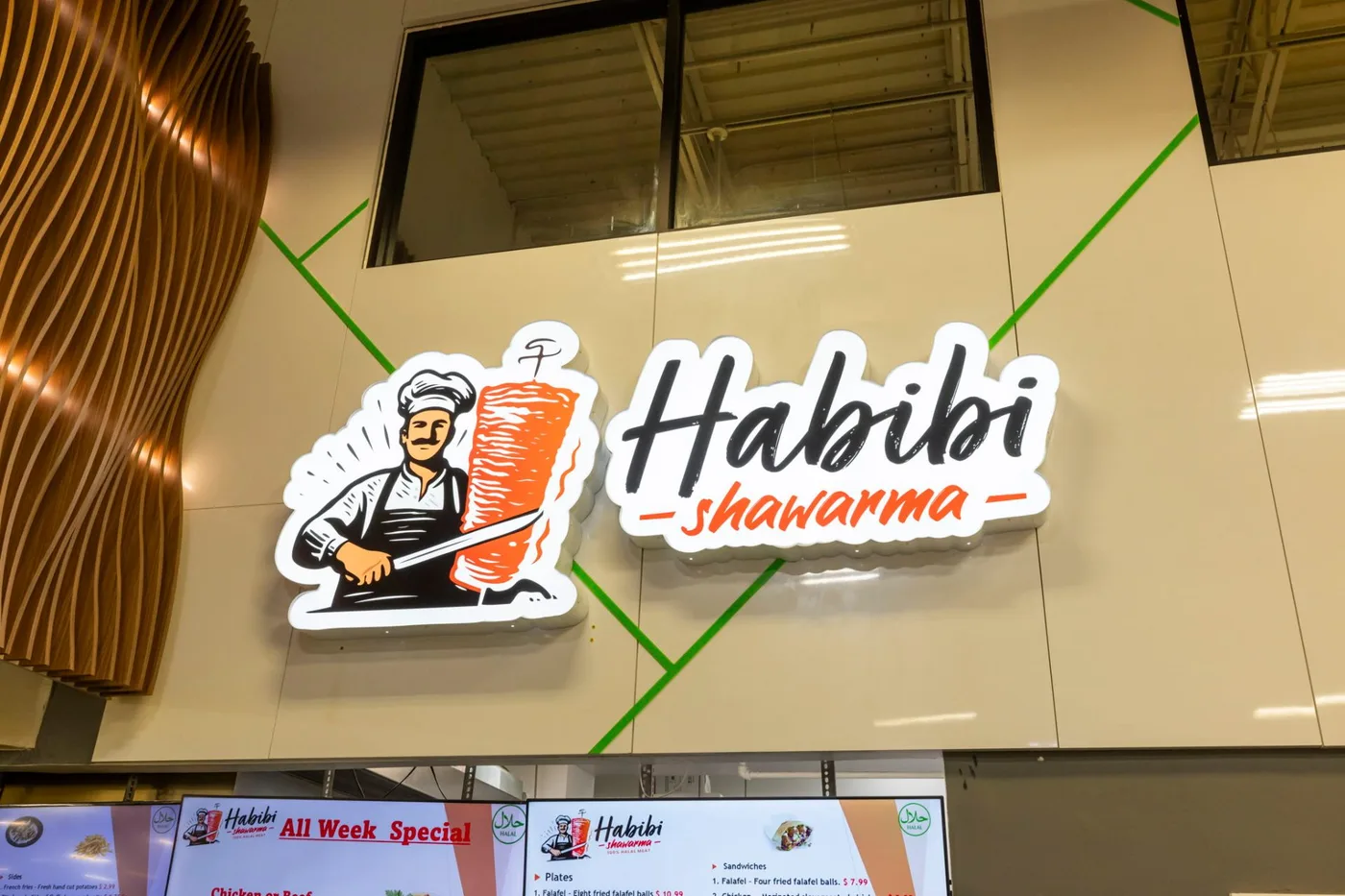 Habibi Shawarma illuminated sign inside Naperville Fresh Market