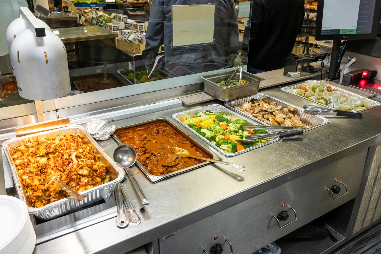 Naperville Taqueria hot food buffet with stewed meats and fresh vegetables